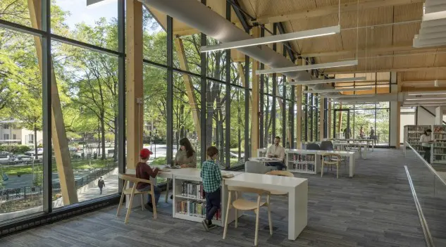 Modern public library interior illustrating how libraries support sustainable development through inclusive learning spaces, community engagement, and equal access to knowledge.