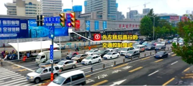 a road with cars and trafic light for reverse variable turn lane