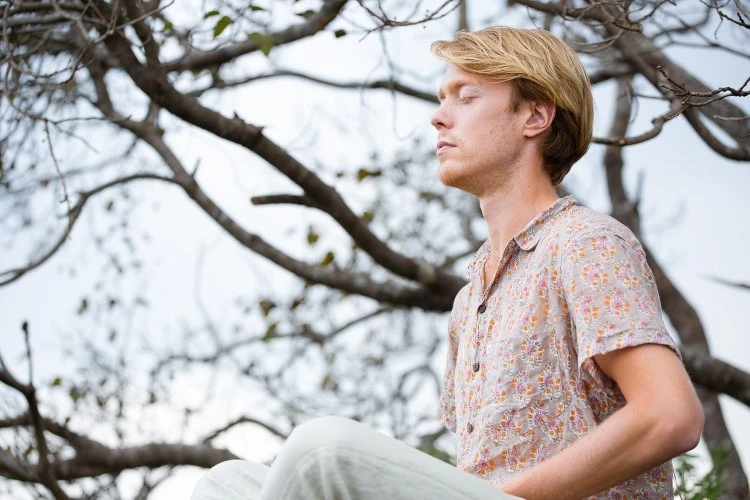A man meditating in nature